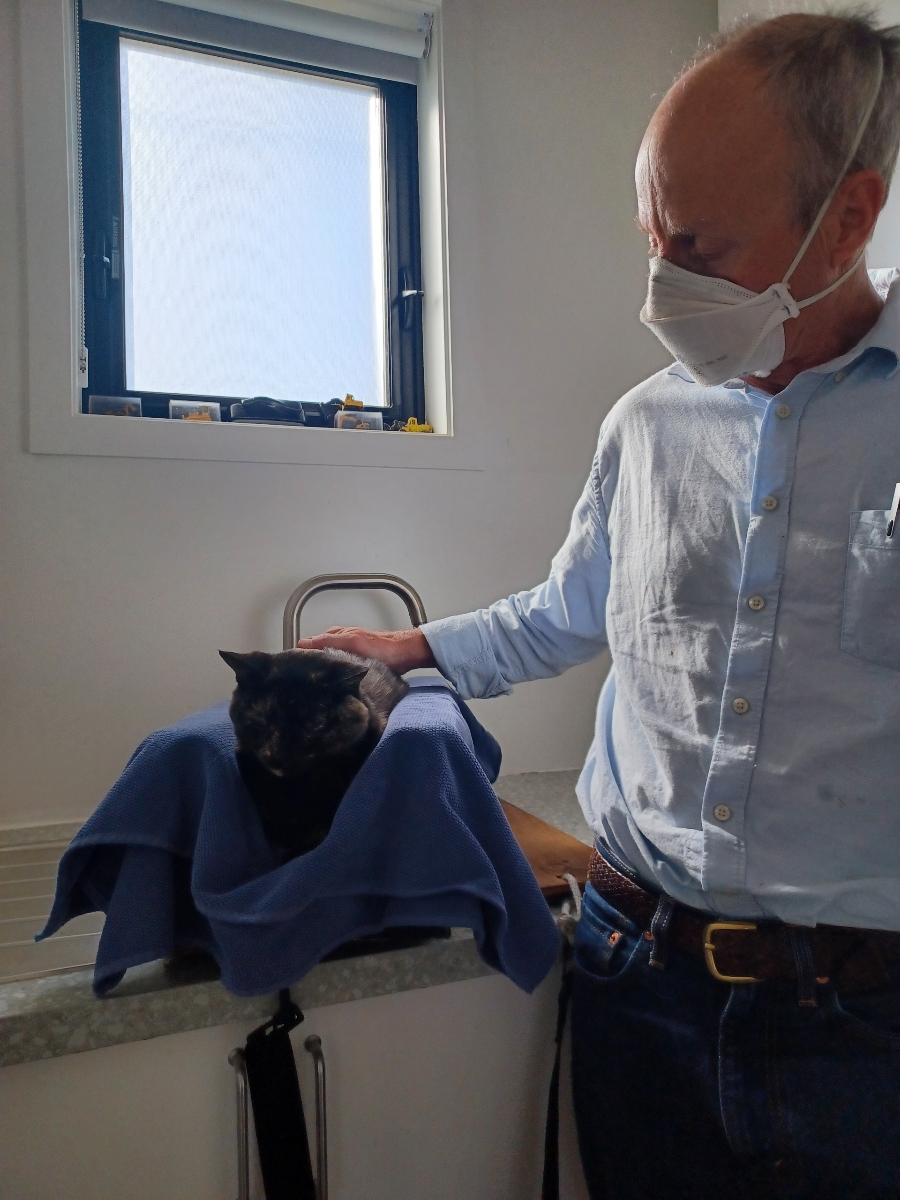 Dr. Grant With a Black Cat